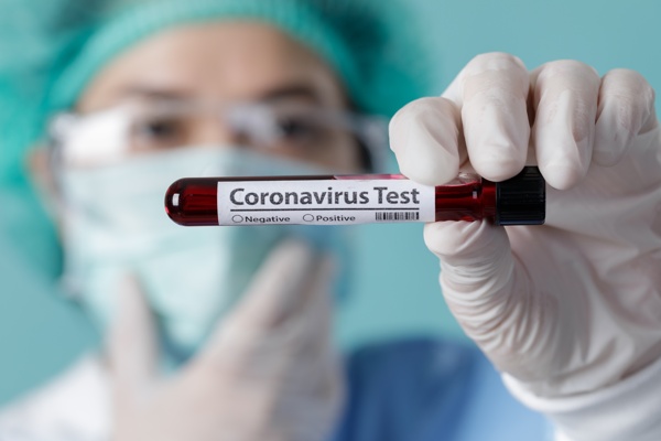 Nurse holding testing patients blood samples for Coronavirus Out